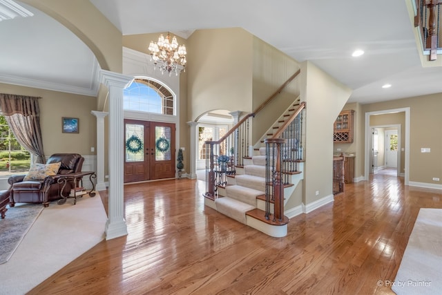 675 Oak Ln, South Elgin, IL 60177 - foyer with arched walkways, french doors, ornate columns, recessed lighting, and ornamental molding