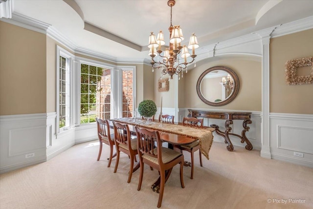 675 Oak Ln, South Elgin, IL 60177 - dining area with light carpet, a chandelier, a wainscoted wall, and a decorative wall