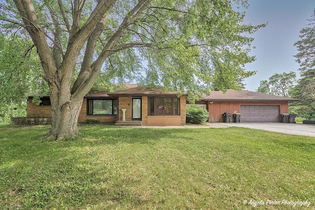 12977 W 9th St, Zion, IL 60099 - view of front of home with concrete driveway, an attached garage, and a front yard