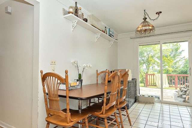 12977 W 9th St, Zion, IL 60099 - dining area with light tile patterned floors and crown molding