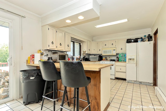12977 W 9th St, Zion, IL 60099 - kitchen featuring white appliances, baseboard heating, light tile patterned floors, a peninsula, and ornamental molding