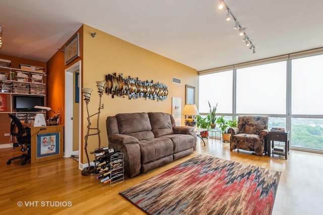 1841 S Calumet Ave Unit 1304, Chicago, IL 60616 - living room with floor to ceiling windows, wood finished floors, a desk, and rail lighting