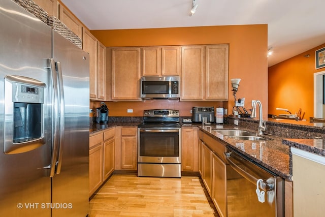 1841 S Calumet Ave Unit 1304, Chicago, IL 60616 - kitchen with stainless steel appliances, light wood finished floors, dark stone counters, and a peninsula