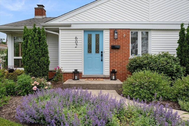 602 E Park Ave, Elmhurst, IL 60126 - entrance to property featuring a chimney and brick siding