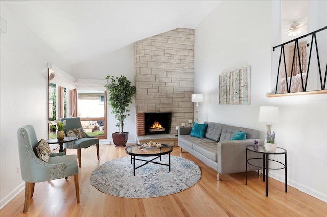 602 E Park Ave, Elmhurst, IL 60126 - living area with wood finished floors, high vaulted ceiling, and a stone fireplace