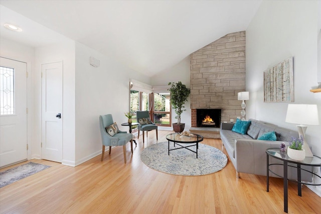 602 E Park Ave, Elmhurst, IL 60126 - living area featuring wood finished floors, a fireplace, and high vaulted ceiling