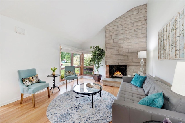 602 E Park Ave, Elmhurst, IL 60126 - living room featuring a fireplace, wood finished floors, and high vaulted ceiling