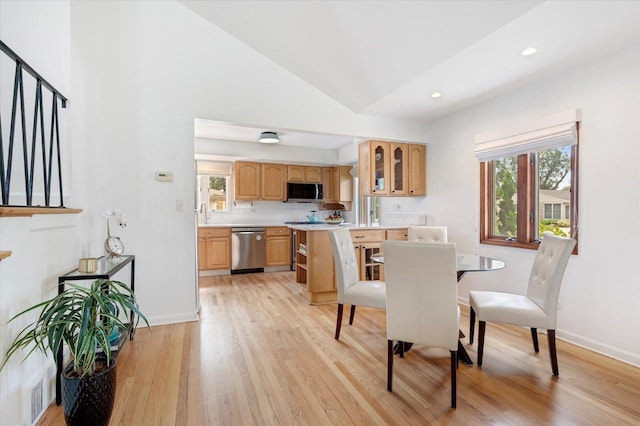 602 E Park Ave, Elmhurst, IL 60126 - dining room with healthy amount of natural light, light wood-style floors, recessed lighting, high vaulted ceiling, and stairs