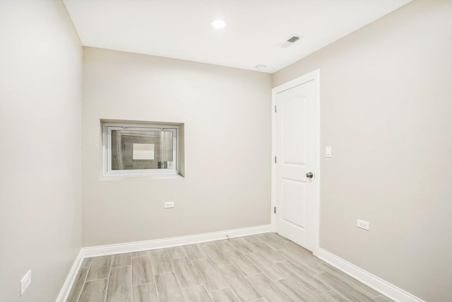 2922 W Polk St, Chicago, IL 60612 - empty room featuring wood tiled floors and recessed lighting