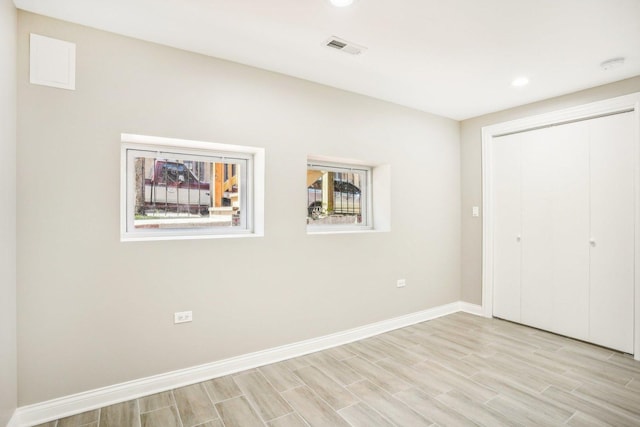 2922 W Polk St, Chicago, IL 60612 - unfurnished bedroom with light wood finished floors, a closet, and recessed lighting