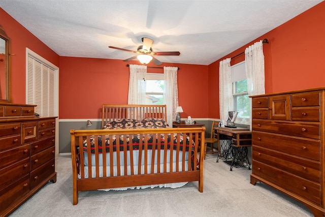 212 Rebecca Ln, Normal, IL 61761 - carpeted bedroom with multiple windows and a ceiling fan
