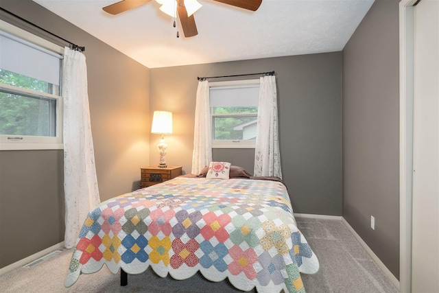 212 Rebecca Ln, Normal, IL 61761 - bedroom featuring carpet flooring, multiple windows, and ceiling fan