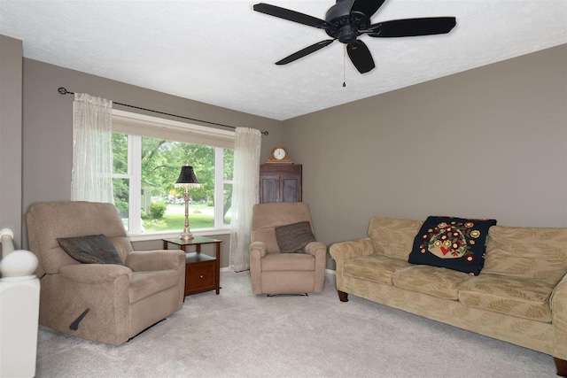 212 Rebecca Ln, Normal, IL 61761 - carpeted living room featuring a ceiling fan and a textured ceiling