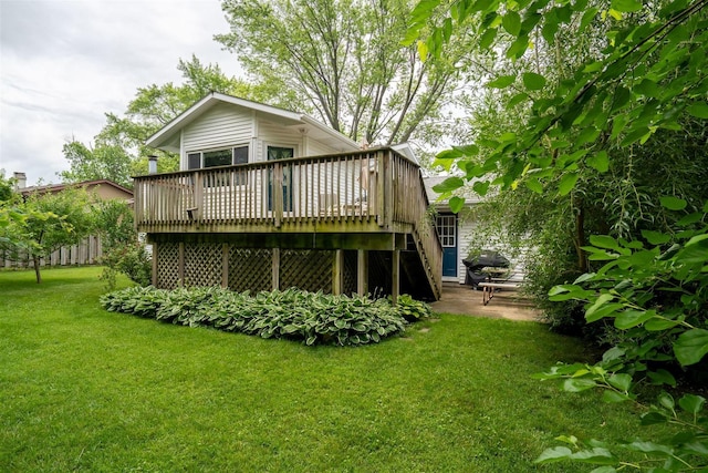 212 Rebecca Ln, Normal, IL 61761 - back of house featuring a lawn and a deck