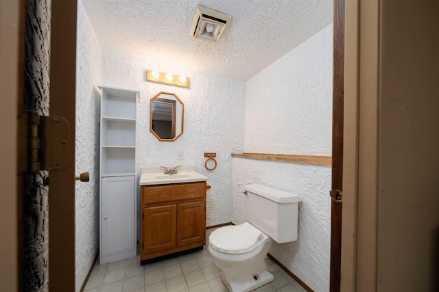 212 Rebecca Ln, Normal, IL 61761 - half bath with a textured wall, a textured ceiling, vanity, and tile patterned floors