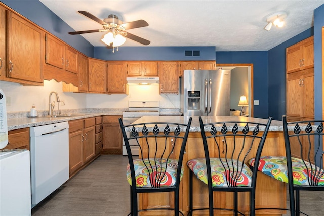 212 Rebecca Ln, Normal, IL 61761 - kitchen featuring white appliances, under cabinet range hood, a ceiling fan, light countertops, and dark wood-style flooring