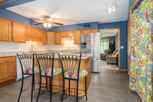 212 Rebecca Ln, Normal, IL 61761 - kitchen featuring stainless steel fridge with ice dispenser, under cabinet range hood, range, a ceiling fan, and a breakfast bar