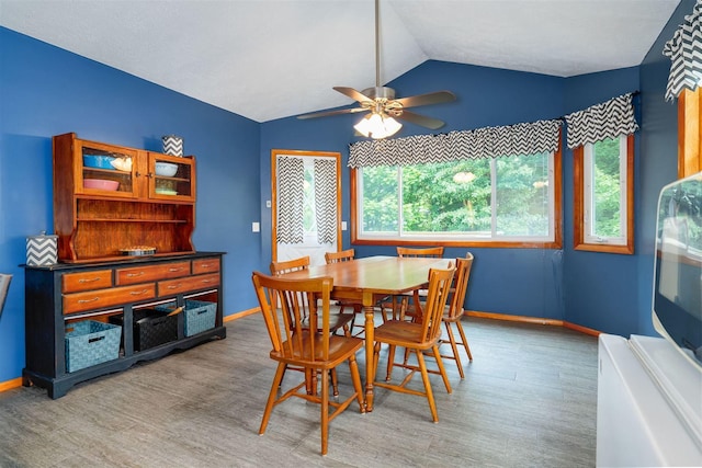 212 Rebecca Ln, Normal, IL 61761 - dining space featuring light wood-type flooring, lofted ceiling, and a ceiling fan