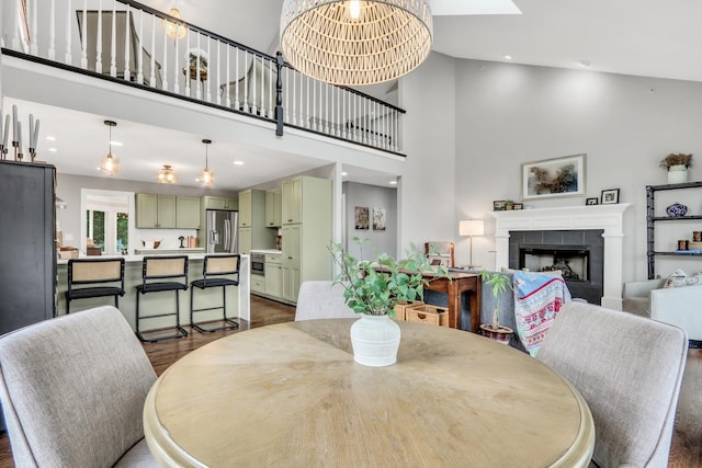 17526 W Windhaven Ct, Grayslake, IL 60030 - dining space with a high ceiling, dark wood finished floors, a fireplace, and recessed lighting