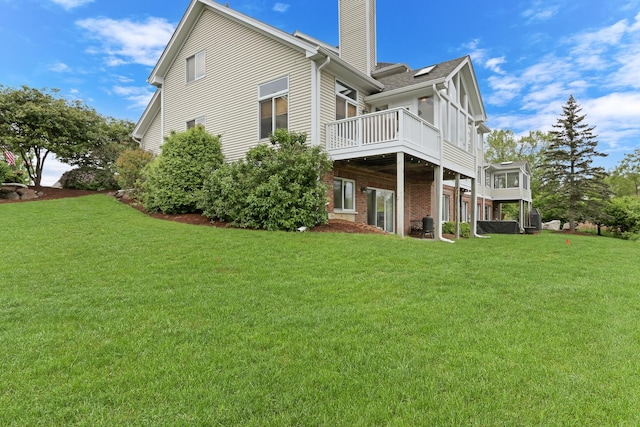 17526 W Windhaven Ct, Grayslake, IL 60030 - rear view of house with a chimney, a lawn, and brick siding
