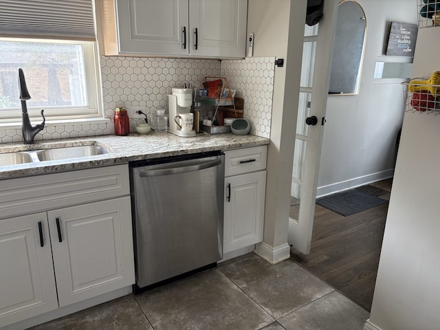 2119 S 20th Ave, Broadview, IL 60155 - kitchen with stainless steel dishwasher, white cabinetry, backsplash, and tile patterned floors