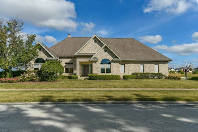 305 Orchard Ln, Beecher, IL 60401 - view of front of property featuring brick siding, a front lawn, a chimney, and roof with shingles