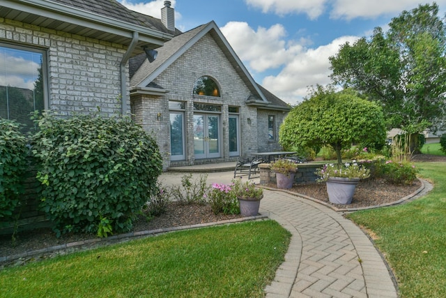 305 Orchard Ln, Beecher, IL 60401 - back of property with brick siding, a chimney, and french doors