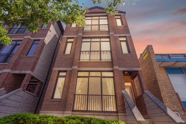 7153 W Irving Park Rd Unit 3, Chicago, IL 60634 - view of property at dusk