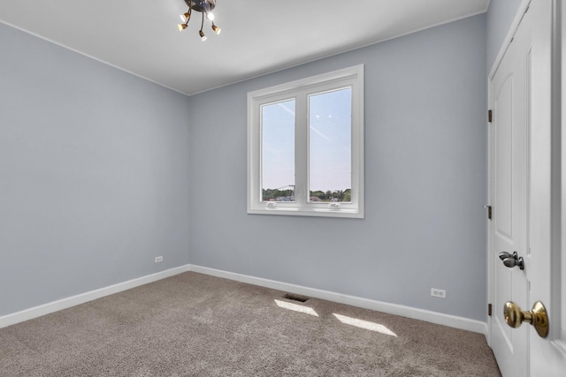 7153 W Irving Park Rd Unit 3, Chicago, IL 60634 - spare room with carpet floors and a chandelier