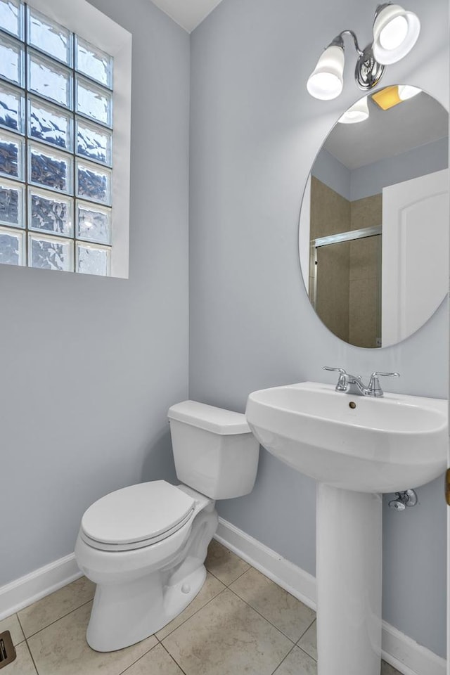 7153 W Irving Park Rd Unit 3, Chicago, IL 60634 - bathroom with tile patterned floors and a shower with shower door