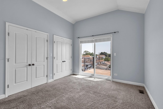 7153 W Irving Park Rd Unit 3, Chicago, IL 60634 - unfurnished bedroom featuring access to exterior, two closets, carpet, and vaulted ceiling