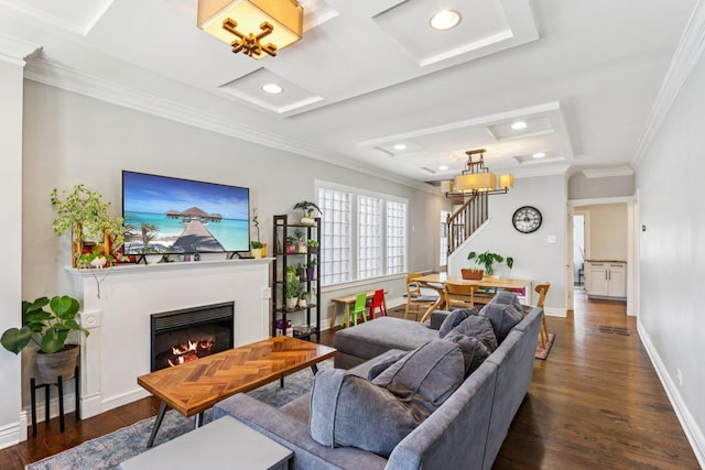 5639 W Cornelia Ave, Chicago, IL 60634 - living area with stairway, dark wood-style floors, a raised ceiling, ornamental molding, and a glass covered fireplace