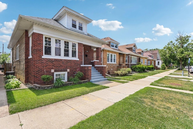 5639 W Cornelia Ave, Chicago, IL 60634 - bungalow-style house with brick siding, a front yard, and a residential view