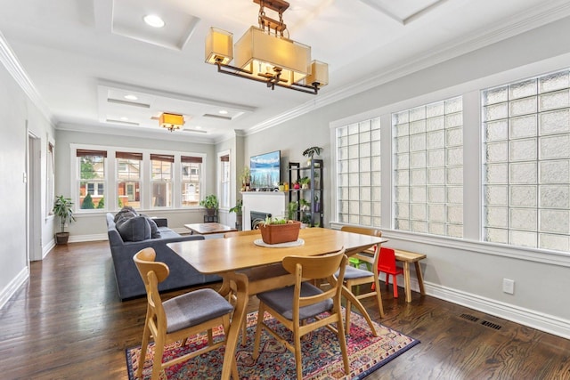 5639 W Cornelia Ave, Chicago, IL 60634 - dining room with ornamental molding, wood finished floors, a raised ceiling, and attic access