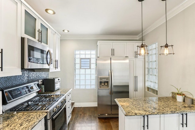5639 W Cornelia Ave, Chicago, IL 60634 - kitchen featuring appliances with stainless steel finishes, light stone counters, backsplash, ornamental molding, and dark wood-style floors