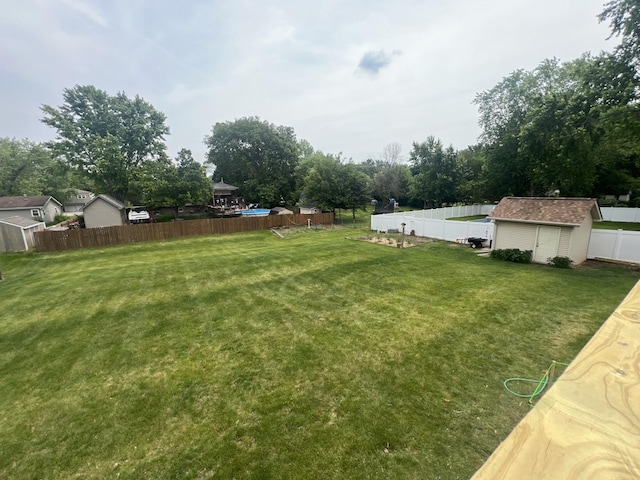 24005 S Green Heron Dr, Channahon, IL 60410 - fenced backyard featuring a storage unit