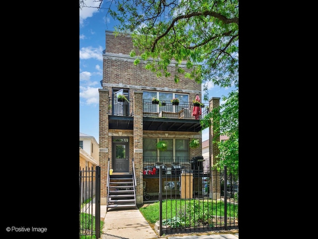 4030 N California Ave Unit 3, Chicago, IL 60618 - view of front of property featuring brick siding, covered porch, and a balcony