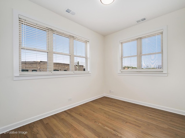 4030 N California Ave Unit 3, Chicago, IL 60618 - unfurnished room with healthy amount of natural light and wood finished floors