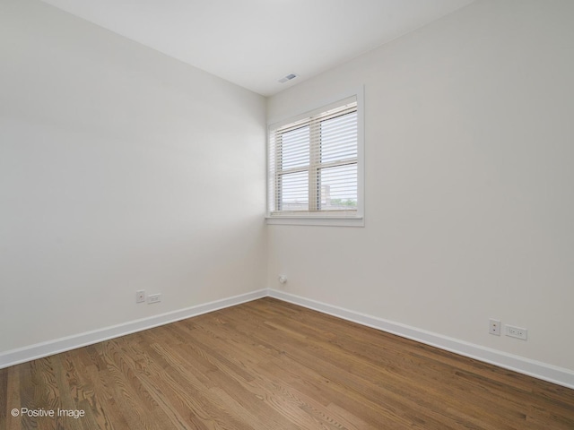 4030 N California Ave Unit 3, Chicago, IL 60618 - empty room featuring baseboards and wood finished floors