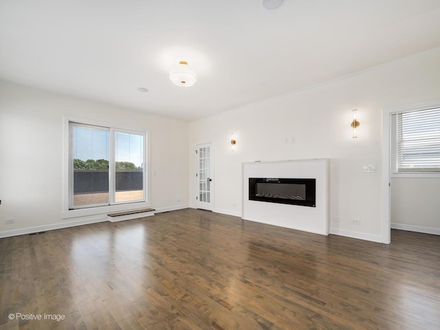 4030 N California Ave Unit 3, Chicago, IL 60618 - unfurnished living room with plenty of natural light, wood finished floors, and a glass covered fireplace