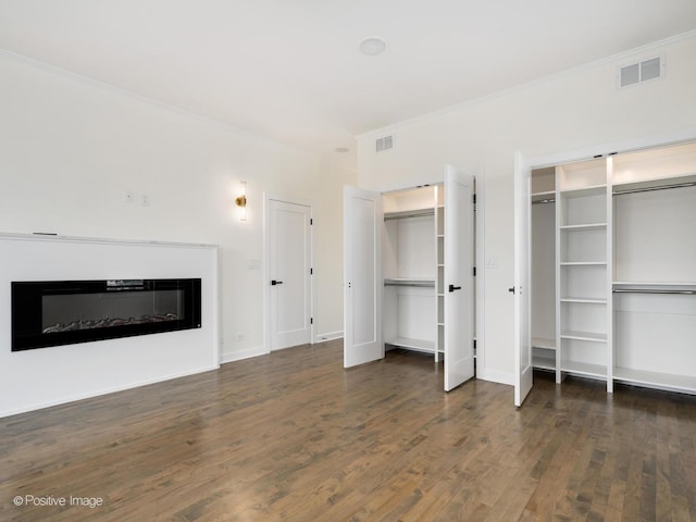 4030 N California Ave Unit 3, Chicago, IL 60618 - unfurnished living room featuring wood finished floors, a glass covered fireplace, and crown molding