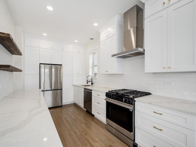 4030 N California Ave Unit 3, Chicago, IL 60618 - kitchen featuring appliances with stainless steel finishes, wall chimney range hood, backsplash, white cabinets, and dark wood-style floors