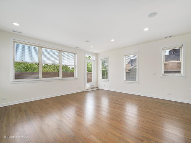 4030 N California Ave Unit 3, Chicago, IL 60618 - spare room with wood finished floors and recessed lighting