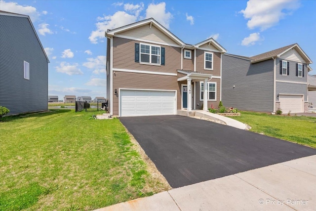 1360 Vineyard Ln, Pingree Grove, IL 60140 - view of front of property featuring a garage, asphalt driveway, and a front lawn