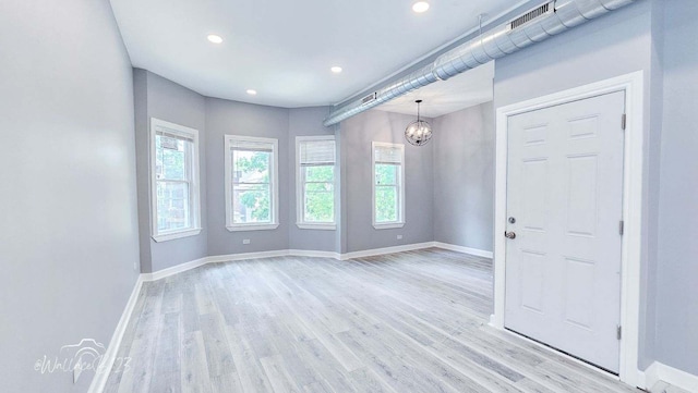 5309 S Bishop St, Chicago, IL 60609 - unfurnished room featuring healthy amount of natural light, light wood-type flooring, a chandelier, and recessed lighting