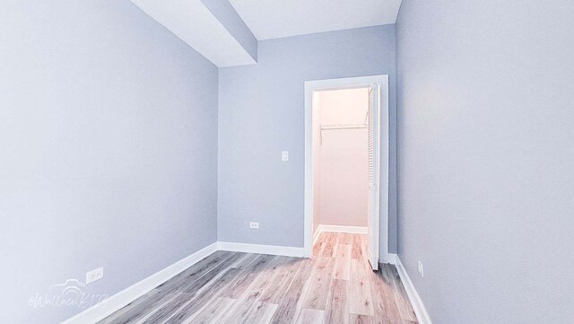 5309 S Bishop St, Chicago, IL 60609 - spare room featuring light wood-style flooring and baseboards