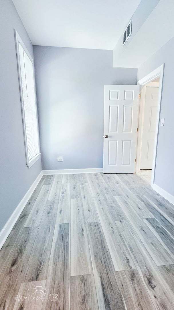 5309 S Bishop St, Chicago, IL 60609 - spare room with light wood-style floors