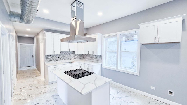 5309 S Bishop St, Chicago, IL 60609 - kitchen featuring island exhaust hood, light stone countertops, black gas cooktop, white cabinets, and a kitchen island