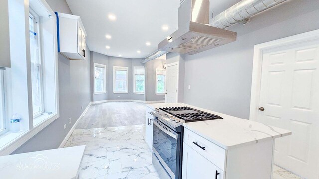 5309 S Bishop St, Chicago, IL 60609 - kitchen featuring island range hood, light marble finish floors, stainless steel range with gas cooktop, recessed lighting, and white cabinets