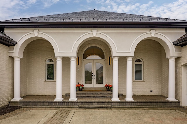 7 Loblolly Ct, Lemont, IL 60439 - doorway to property featuring french doors, covered porch, and brick siding